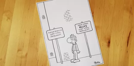 Comic von Ralph Ruthe auf Holz liegend.