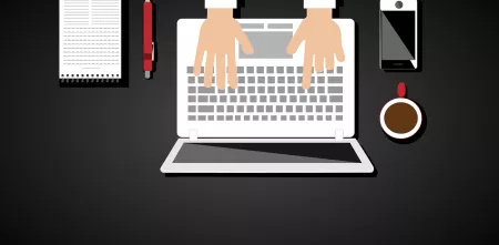 Schreibtisch mit Laptop von oben